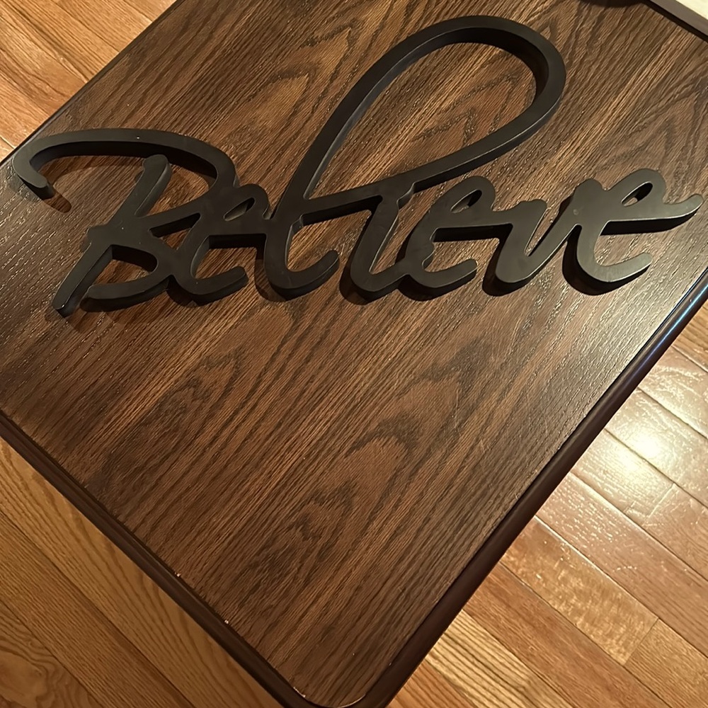 Black BELIEVE sign wall decor. Medium size.